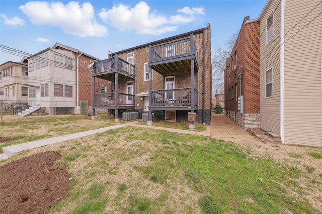 5044 Lindenwood Ave, Saint Louis, MO 63109 - back of property with cooling unit, a yard, and brick siding