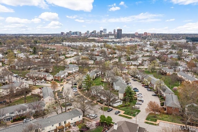 aerial view of property and surrounding area with a skyline view