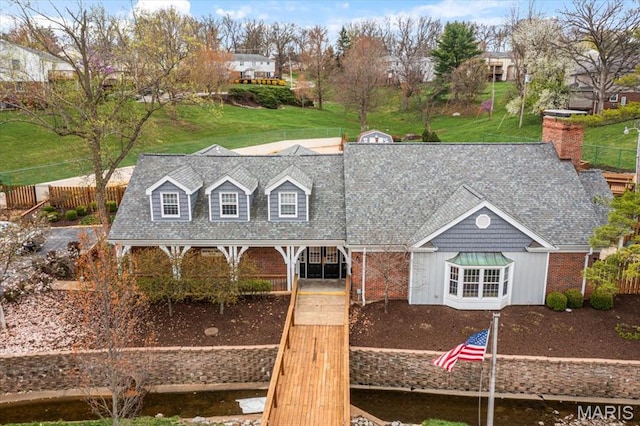 cape cod-style house with a shingled roof
