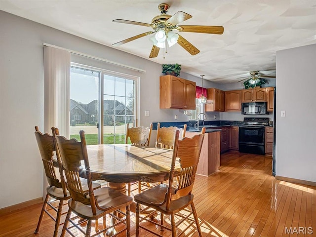 100 Fairway Dr, Waterloo, IL 62298 - dining room with a ceiling fan, light wood-style flooring, and baseboards