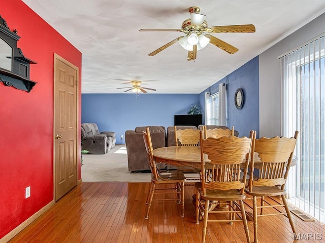 100 Fairway Dr, Waterloo, IL 62298 - dining area featuring hardwood / wood-style flooring, ceiling fan, and baseboards