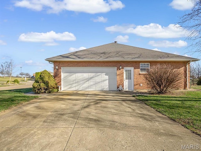100 Fairway Dr, Waterloo, IL 62298 - view of front of home with concrete driveway, a garage, brick siding, and a shingled roof