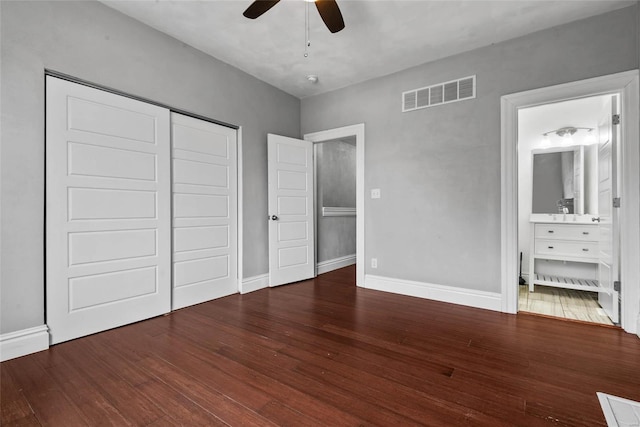 2714 Texas Ave, Saint Louis, MO 63118 - unfurnished bedroom with wood finished floors, baseboards, and a closet