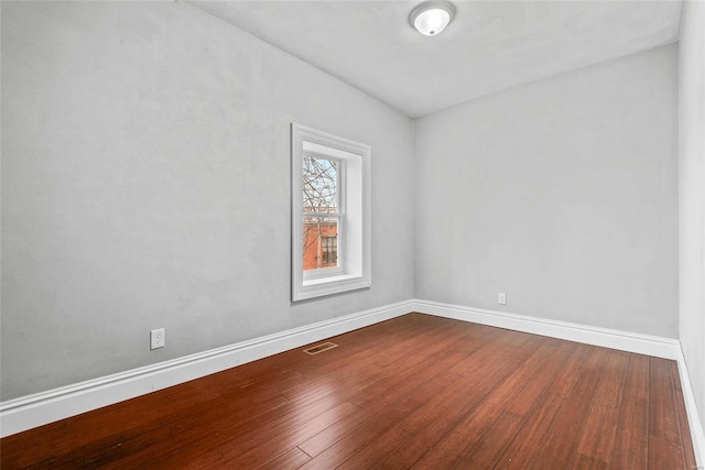 2714 Texas Ave, Saint Louis, MO 63118 - empty room with dark wood-type flooring and baseboards