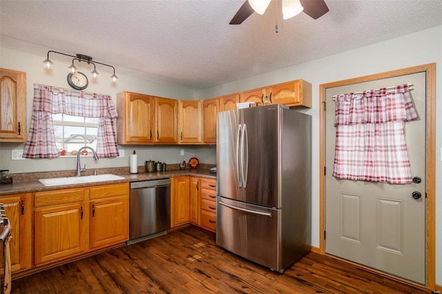 15919 Candy Corner Ln, Carlyle, IL 62231 - kitchen featuring stainless steel appliances, a sink, dark wood-style floors, ceiling fan, and a textured ceiling