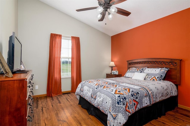 15919 Candy Corner Ln, Carlyle, IL 62231 - bedroom featuring vaulted ceiling, wood finished floors, baseboards, and a ceiling fan