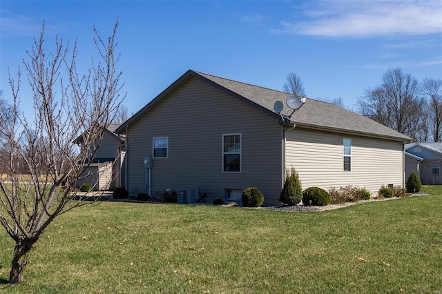 15919 Candy Corner Ln, Carlyle, IL 62231 - view of property exterior featuring a yard, cooling unit, and roof with shingles