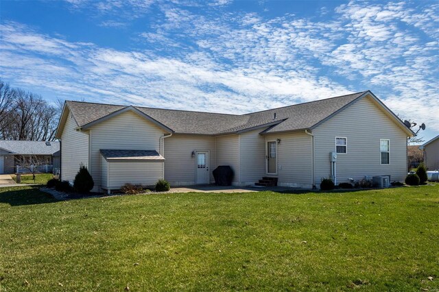 15919 Candy Corner Ln, Carlyle, IL 62231 - rear view of property with entry steps, a lawn, roof with shingles, central AC, and a patio area