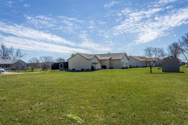 15919 Candy Corner Ln, Carlyle, IL 62231 - view of side of property featuring a lawn, a storage unit, and an outbuilding