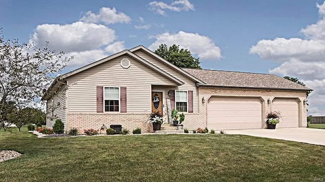 15919 Candy Corner Ln, Carlyle, IL 62231 - ranch-style house featuring brick siding, a garage, driveway, and a front yard