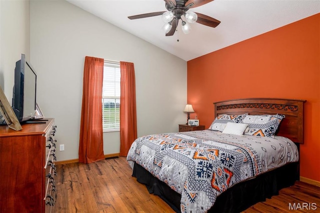 15919 Candy Corner Ln, Carlyle, IL 62231 - bedroom featuring vaulted ceiling, wood finished floors, and a ceiling fan