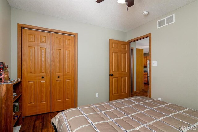 15919 Candy Corner Ln, Carlyle, IL 62231 - bedroom with wood finished floors, a closet, and ceiling fan