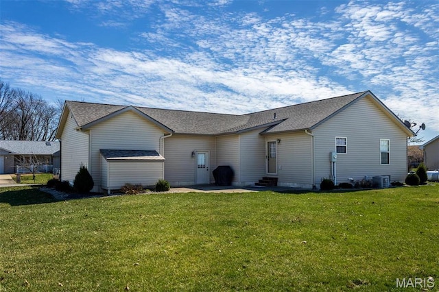 15919 Candy Corner Ln, Carlyle, IL 62231 - rear view of house with entry steps, a lawn, and roof with shingles