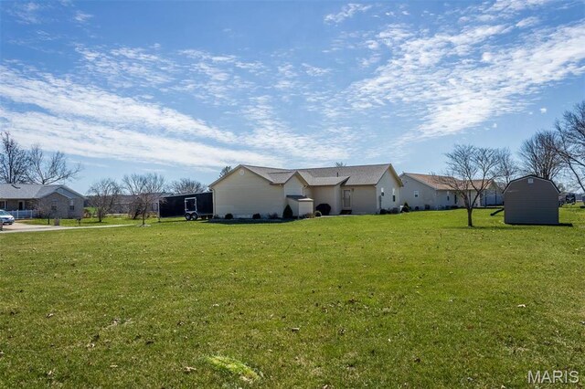 15919 Candy Corner Ln, Carlyle, IL 62231 - view of property exterior with a lawn and a storage unit