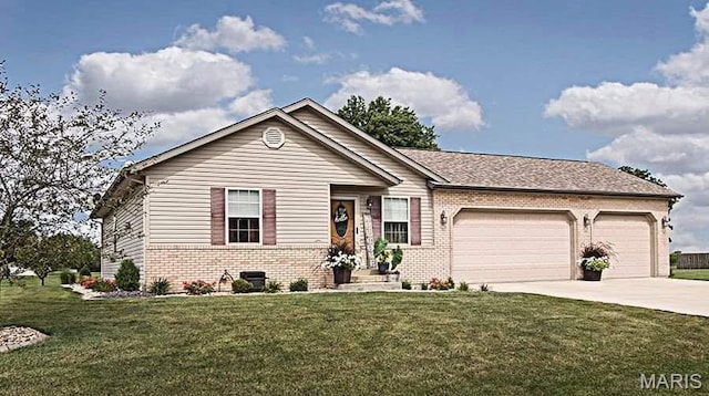 15919 Candy Corner Ln, Carlyle, IL 62231 - ranch-style home with brick siding, a garage, concrete driveway, and a front yard