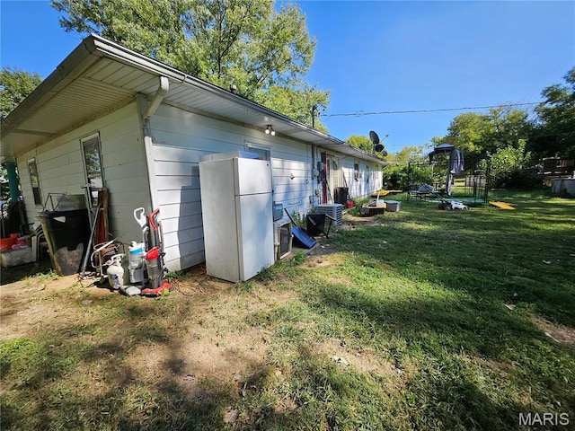 view of home's exterior with a yard