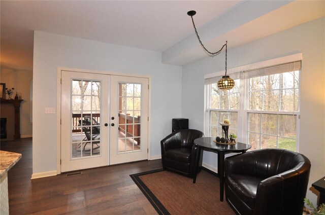 4072 Osage Rdg, House Springs, MO 63051 - living area with french doors, dark wood finished floors, healthy amount of natural light, and baseboards