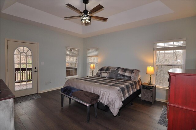 4072 Osage Rdg, House Springs, MO 63051 - bedroom with a raised ceiling, dark wood-style flooring, access to exterior, and multiple windows