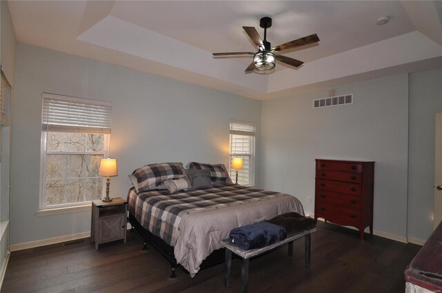 4072 Osage Rdg, House Springs, MO 63051 - bedroom with a tray ceiling, baseboards, and dark wood-style flooring