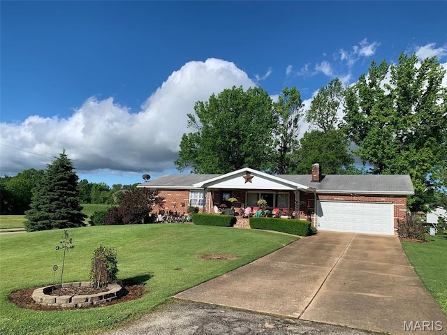 113 S Madison St, Desloge, MO 63601 - single story home featuring an attached garage, covered porch, a front lawn, brick siding, and driveway