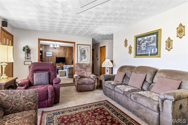 113 S Madison St, Desloge, MO 63601 - carpeted living area featuring a chandelier and a textured ceiling