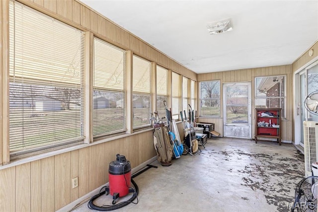 113 S Madison St, Desloge, MO 63601 - sunroom with concrete flooring, wood walls, and healthy amount of natural light