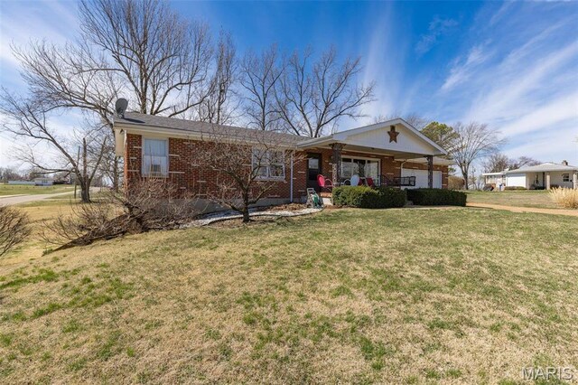 113 S Madison St, Desloge, MO 63601 - ranch-style home featuring brick siding, covered porch, and a front lawn