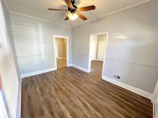 4720 Goethe Ave, Saint Louis, MO 63116 - unfurnished room featuring a ceiling fan, wood finished floors, crown molding, baseboards, and a wainscoted wall