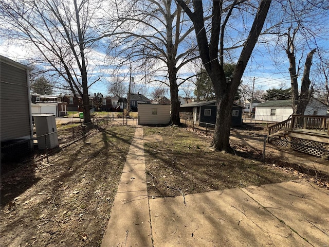4720 Goethe Ave, Saint Louis, MO 63116 - view of yard with fence, an outdoor structure, and a storage shed