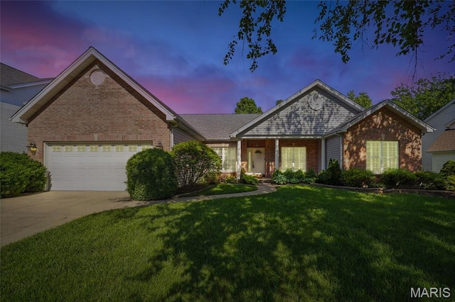 ranch-style home featuring brick siding, a lawn, concrete driveway, and a garage