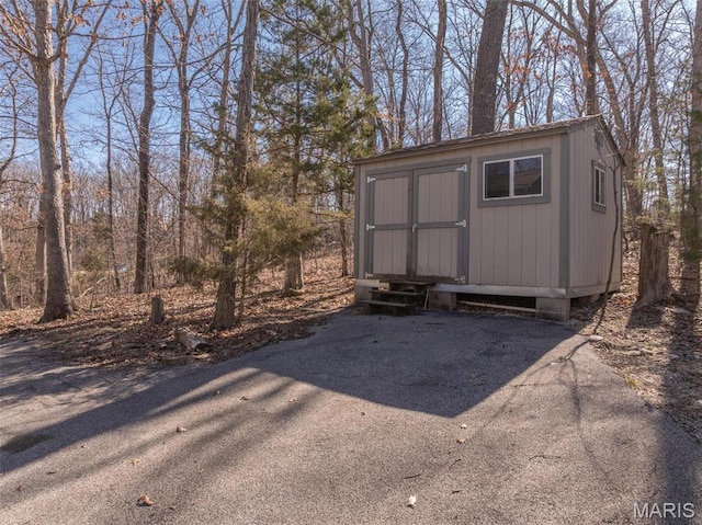 2442 Linden Point Dr, Innsbrook, MO 63390 - view of shed featuring asphalt driveway
