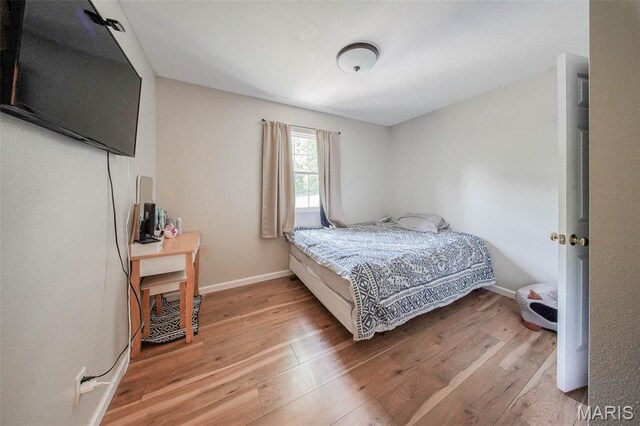 24478 Trolley Ln, Saint Robert, MO 65584 - bedroom with wood finished floors and baseboards