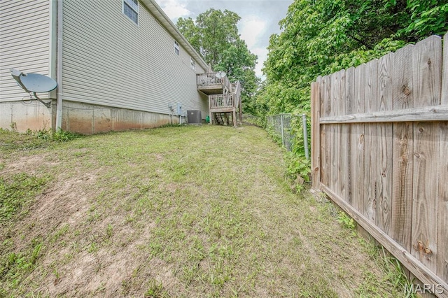 24478 Trolley Ln, Saint Robert, MO 65584 - view of yard with central AC, stairway, and a wooden deck