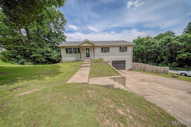 24478 Trolley Ln, Saint Robert, MO 65584 - view of front of property with driveway and a garage