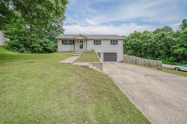 24478 Trolley Ln, Saint Robert, MO 65584 - view of front facade featuring driveway and an attached garage