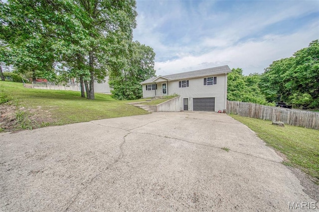 24478 Trolley Ln, Saint Robert, MO 65584 - raised ranch featuring concrete driveway and a garage