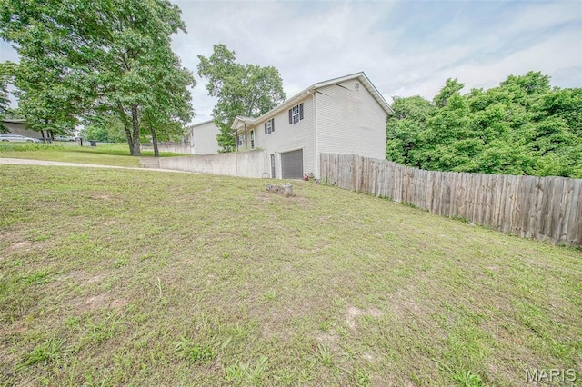 24478 Trolley Ln, Saint Robert, MO 65584 - view of yard featuring a garage