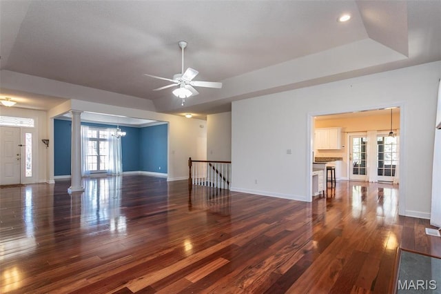 10 Dunbridge Ct, Glen Carbon, IL 62034 - unfurnished living room featuring ornate columns, a chandelier, dark wood finished floors, ceiling fan, and recessed lighting