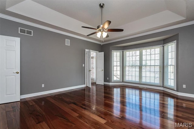 10 Dunbridge Ct, Glen Carbon, IL 62034 - spare room featuring a tray ceiling, wood finished floors, a ceiling fan, and crown molding
