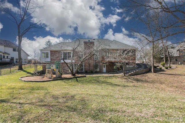 10 Dunbridge Ct, Glen Carbon, IL 62034 - rear view of property featuring a playground and brick siding