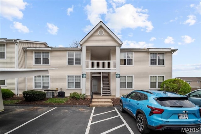 4304 Inlet Isle Dr, Florissant, MO 63034 - view of building exterior with uncovered parking and central AC