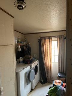 19050 Sikes Rd, Saint Genevieve, MO 63670 - laundry room with washer and clothes dryer and a textured ceiling