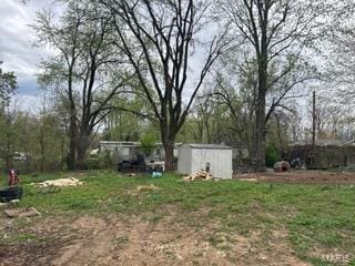 19050 Sikes Rd, Saint Genevieve, MO 63670 - view of yard featuring a storage shed and an outdoor structure