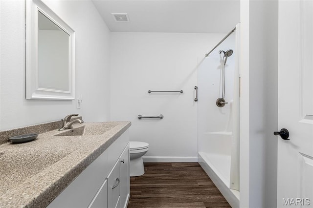 533 Windsor Ln, Farmington, MO 63640 - full bath with a stall shower, wood finished floors, vanity, toilet, and baseboards