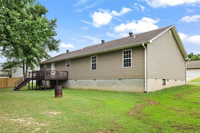 rear view of house with crawl space, a deck, stairway, and a yard