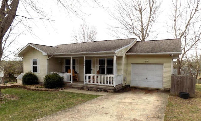 ranch-style house featuring covered porch, an attached garage, concrete driveway, and roof with shingles