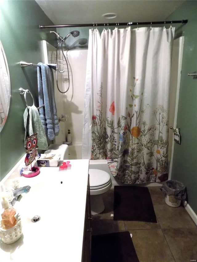 bathroom with shower / bath combo with shower curtain, tile patterned flooring, vanity, and toilet