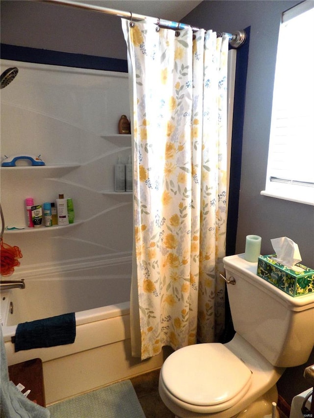 full bath featuring toilet and shower / bath combo with shower curtain