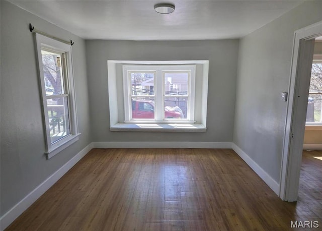 427 S Louisiana St, Cape Girardeau, MO 63703 - spare room featuring healthy amount of natural light, dark wood finished floors, and baseboards