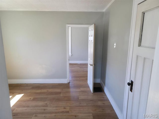 427 S Louisiana St, Cape Girardeau, MO 63703 - spare room featuring baseboards, wood finished floors, and ornamental molding